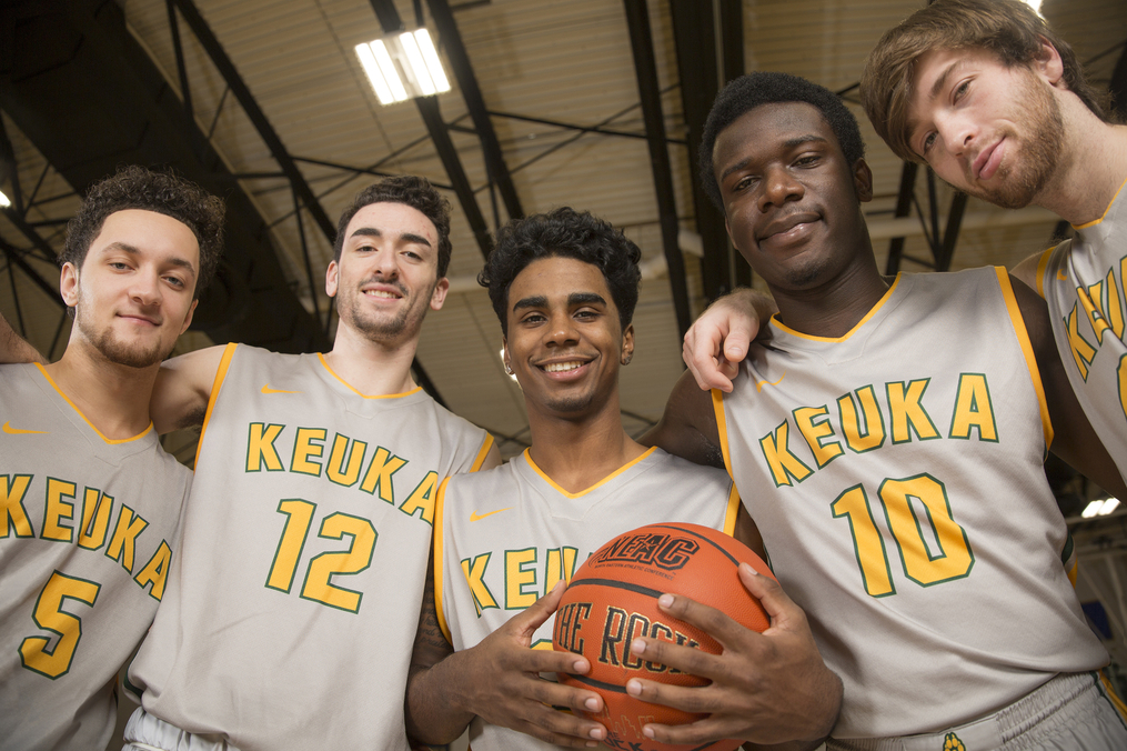 KC Basketball Team posing on the court